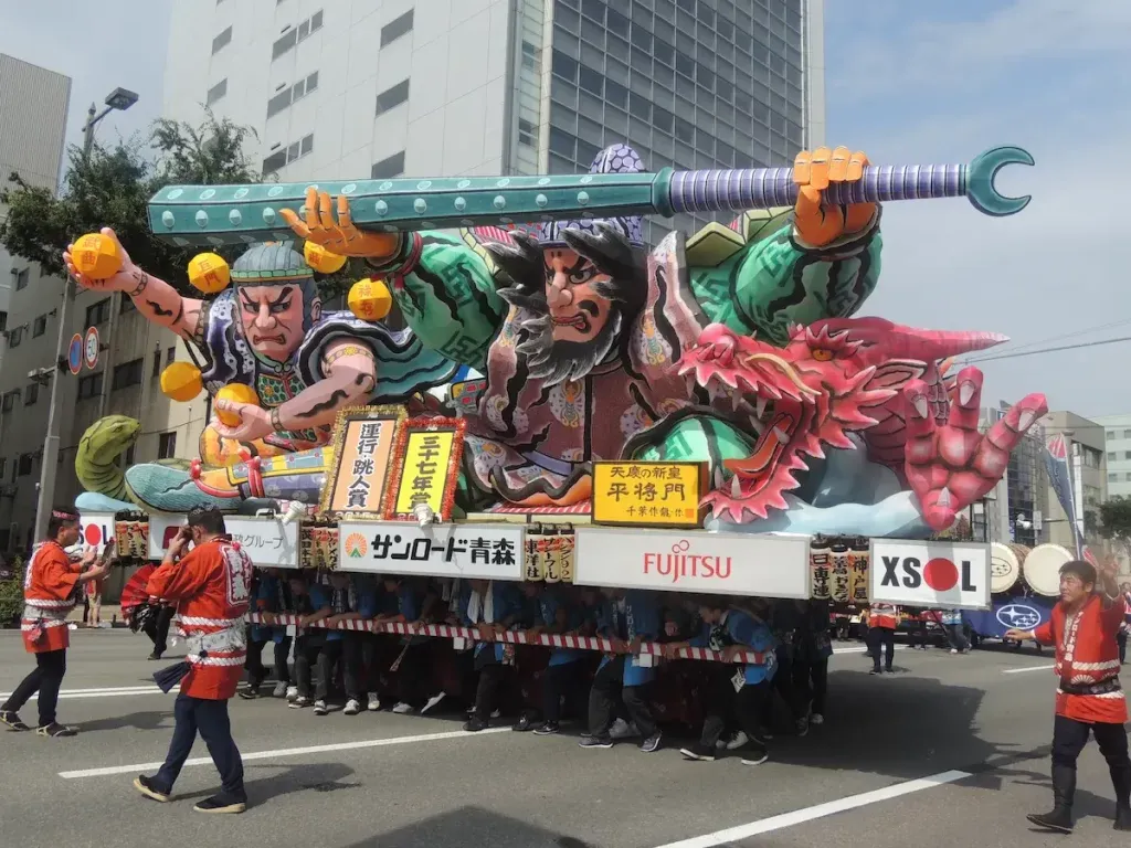 People carrying Taira no Masakodo float during a Nebuta Festival